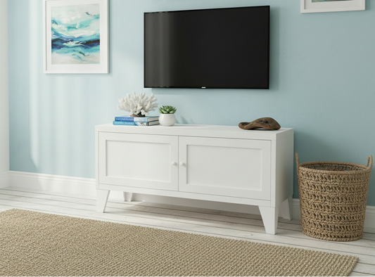 White metal entertainment console with a TV and plant in a living room setting