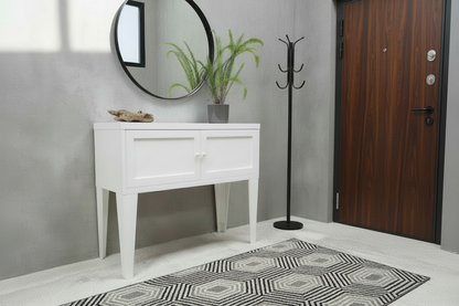 White metal hall cabinet against a light gray wall with a plant on top