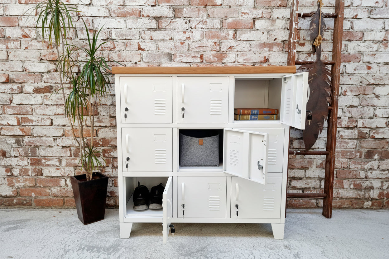 White metal storage locker cabinet with open doors in a room with a plant and decorative items.