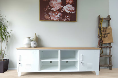 White metal storage unit with oak top and open middles shelves in a room with a floral painting on the wall.
