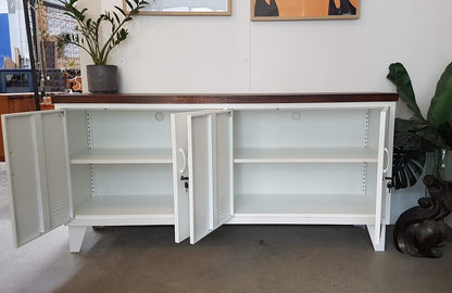 White metal versatile credenza with dark Rimu top with open doors, showing adjustable shelves