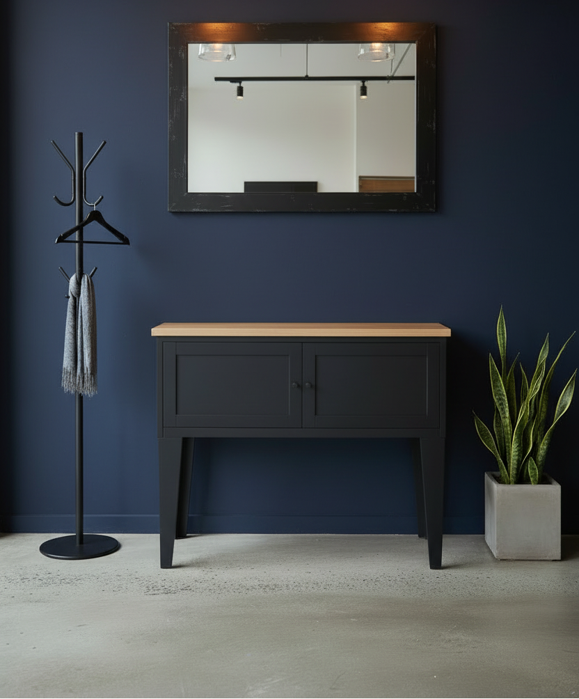 Hall table made of metal with Oak top against a blue wall