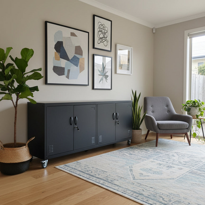 Living room with gray armchair, black metal storage cabinet on wheels and framed artwork on the wall.