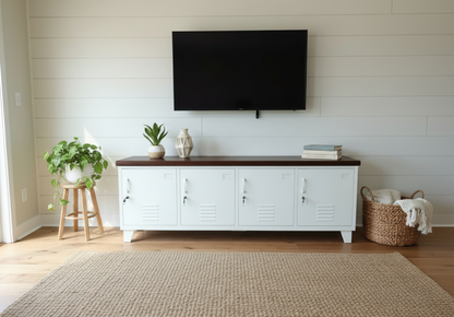 White metal entertainment console with Dark Rimu top in a room with a TV mounted on the wall.