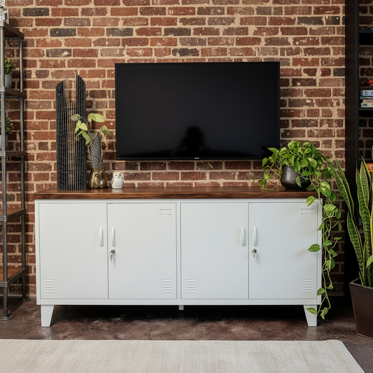 White Steel cabinet with wooden top under a television in a room with plants.