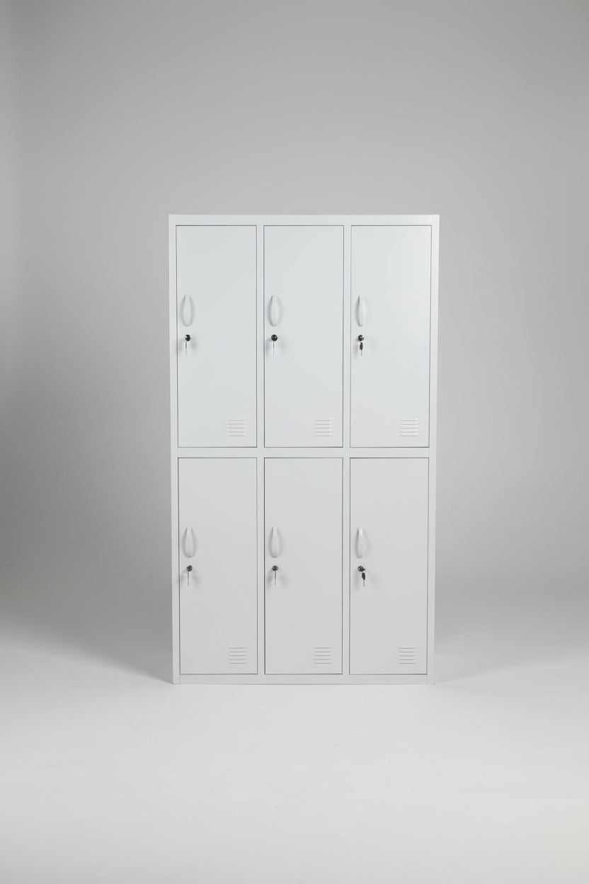 A tall white metal locker cabinet with six doors, shown standing in a warehouse or workshop environment.