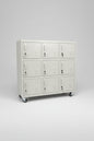 A white 9-door metal locker with caster wheels
