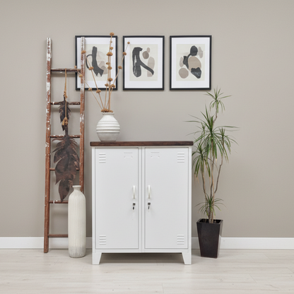 A white double side cabinet with a dark stained oak top in a light bright stylish hallway