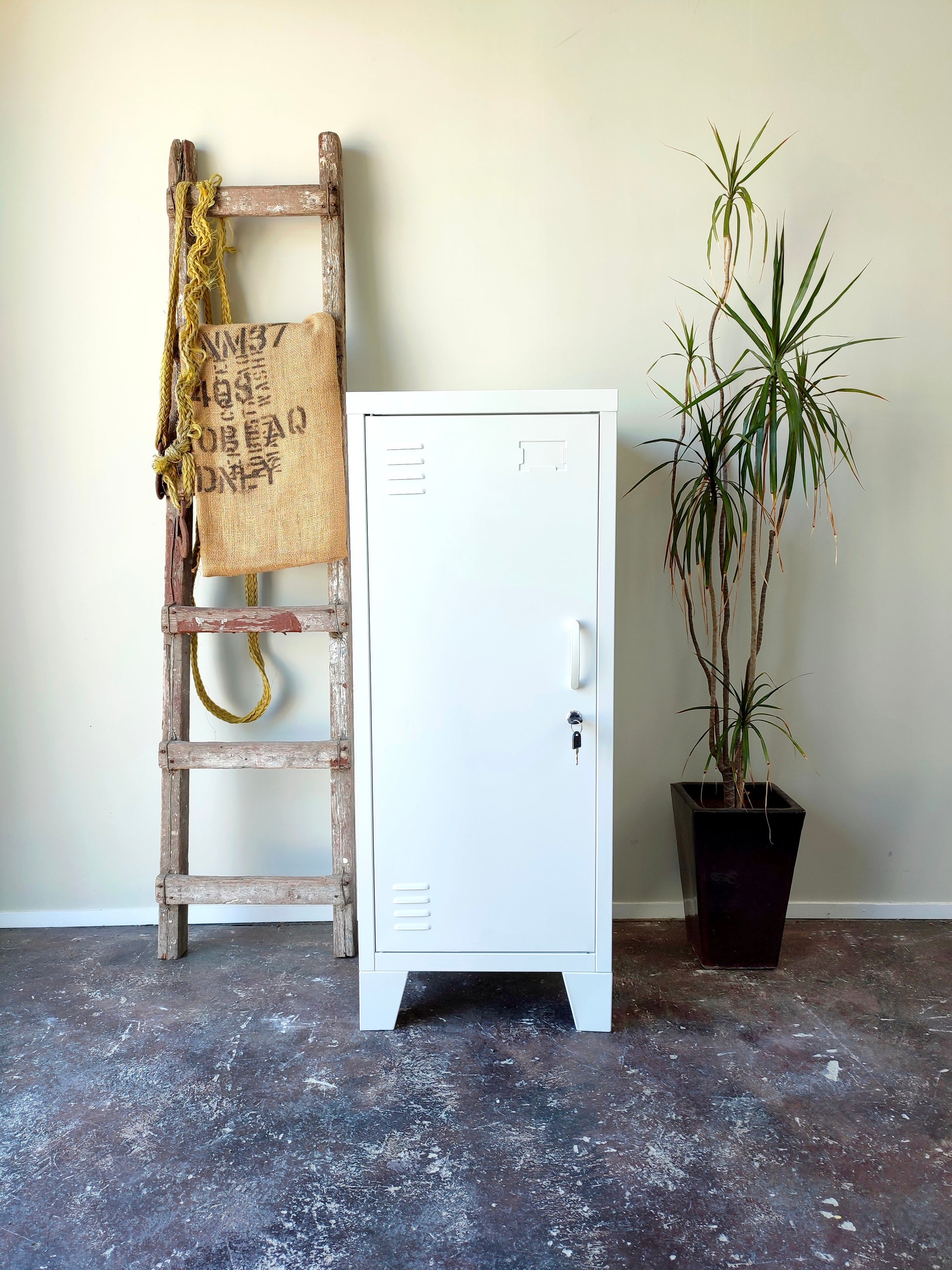 white metal side cabinet with a left hinge door