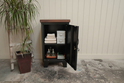 wood top on black mini locker with stuff stored inside 