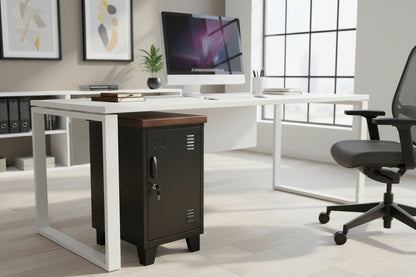 A black mini locker with a dark oak top, sitting underneath a desk 
