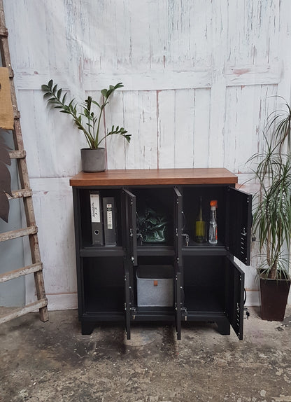 A Black Metal 6-door locker with dark oak top with doors open to show folders, wine bottles and bags inside