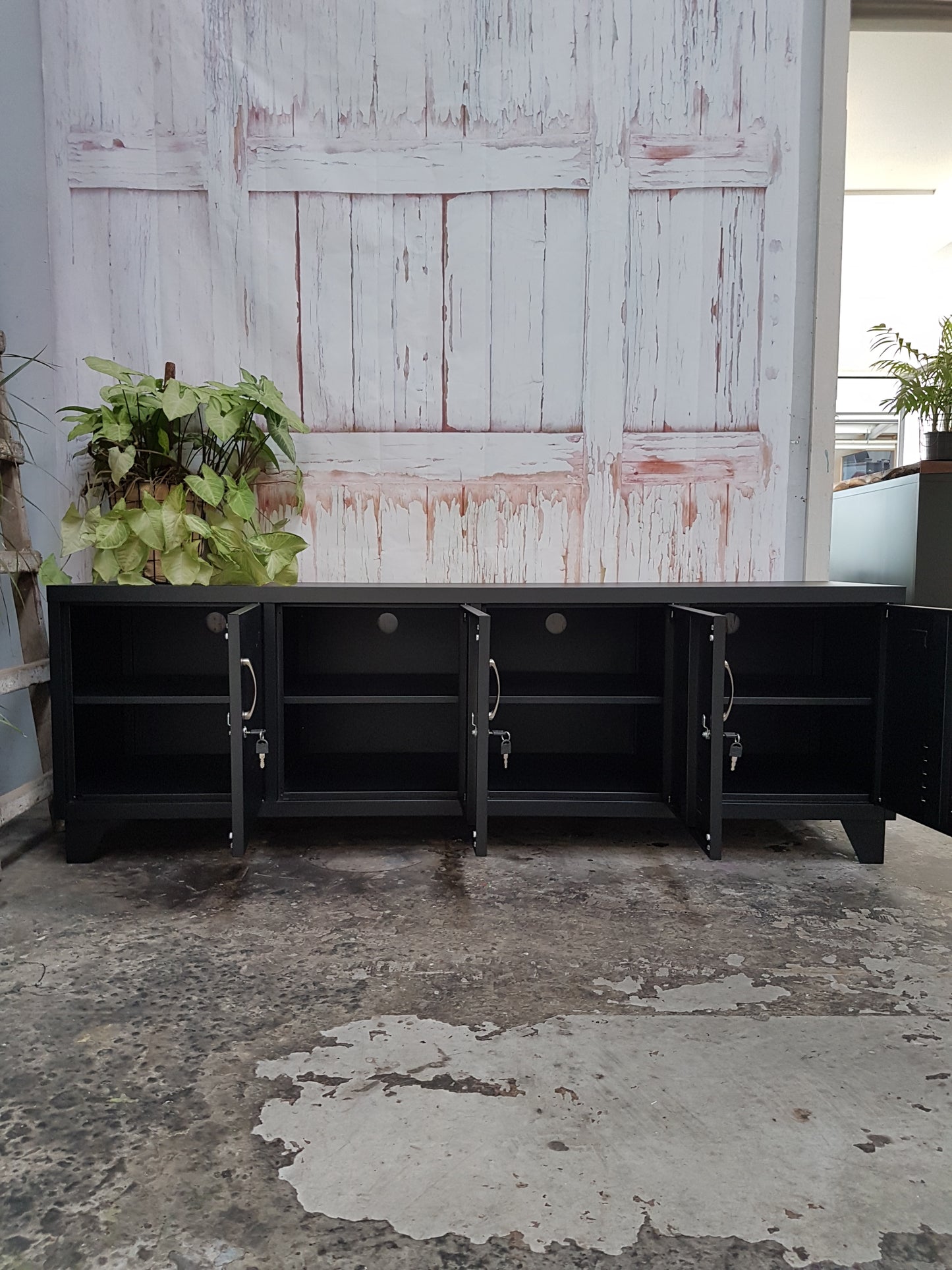 Large Black metal entertainment TV locker cabinet with doors open