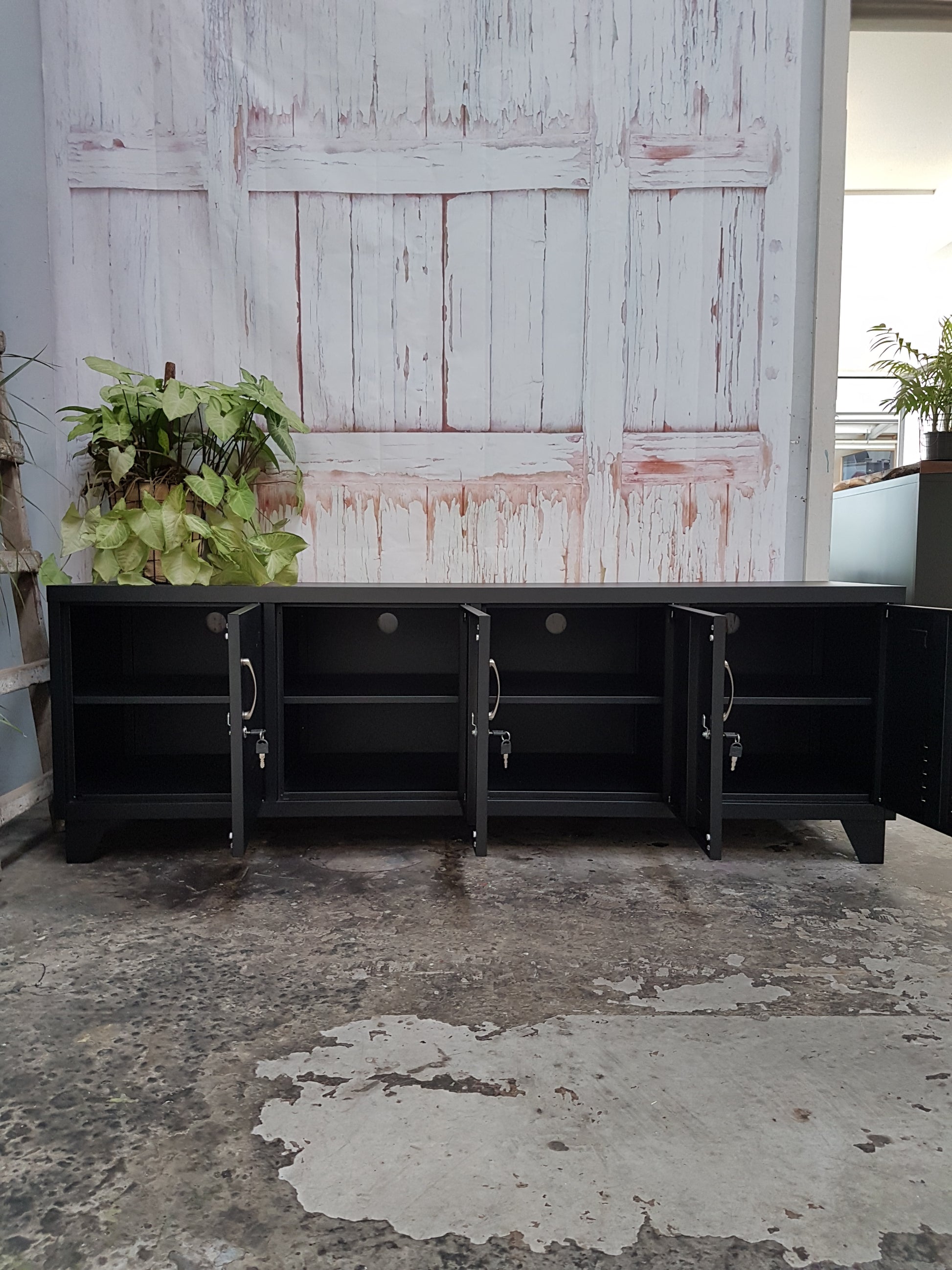 Large Black metal entertainment TV locker cabinet with doors open