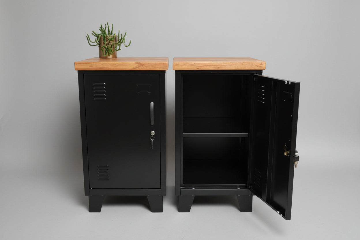 Two black mini lockers with recycled Rimu tops, one with the door open showing the interior shelf, the other with the door closed. Set against a weathered wooden backdrop.