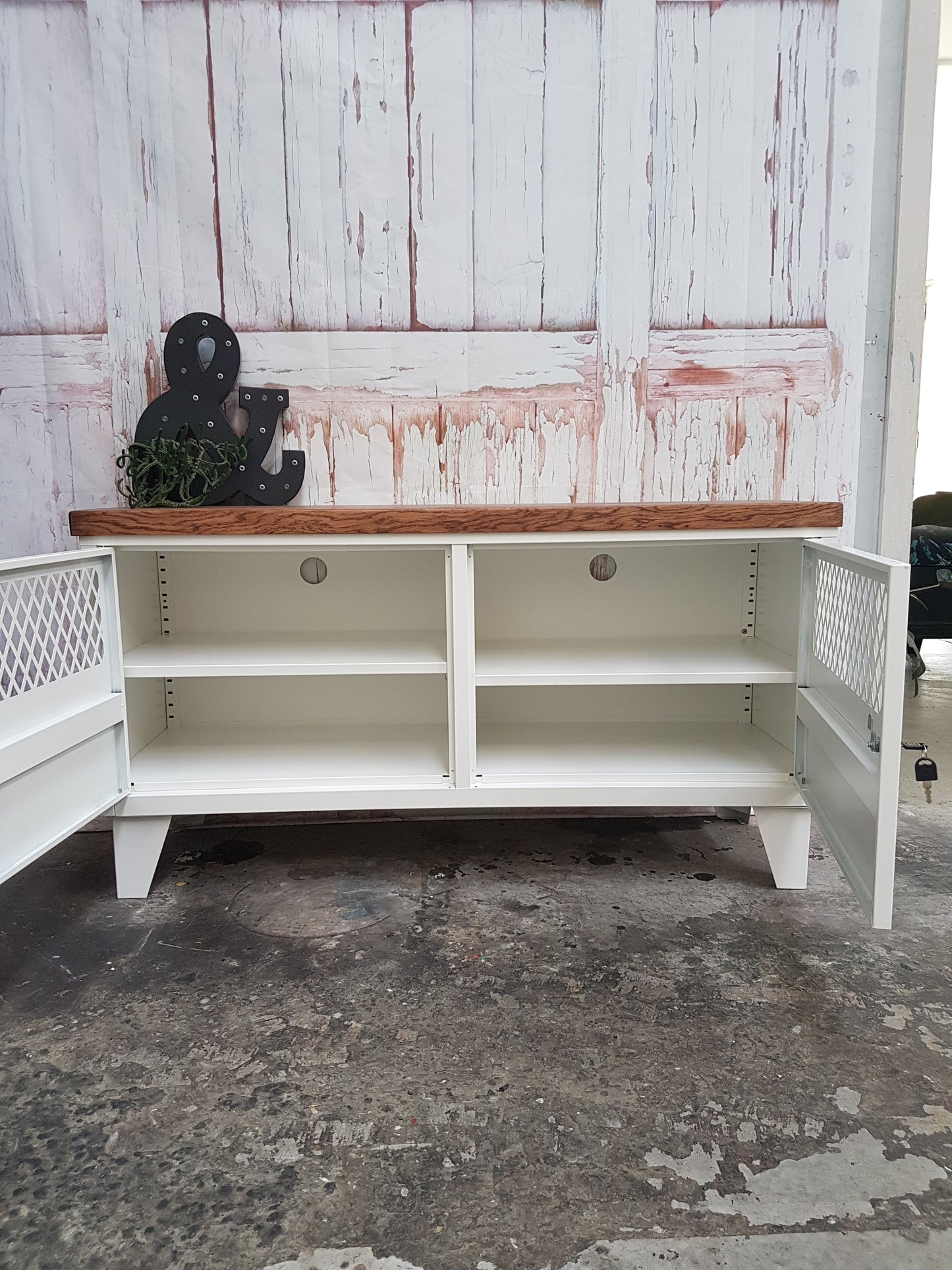 White Metal TV Cabinet with Dark Oak top. Doors open to show adjustable shelves and cable holes