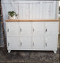 A white 8-door sideboard locker with an oak top, featuring multiple small lockers beneath the oak surface.