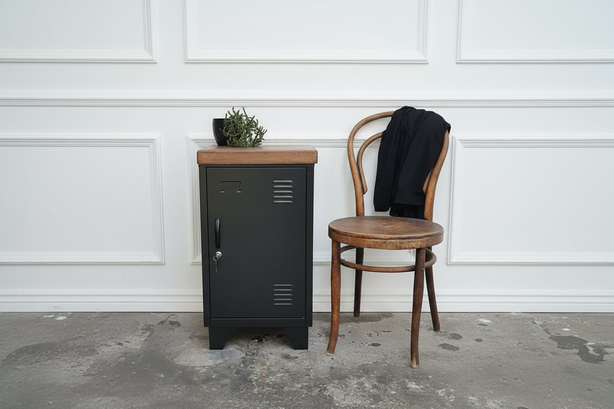 black right opening metal locker next to rustic chair 