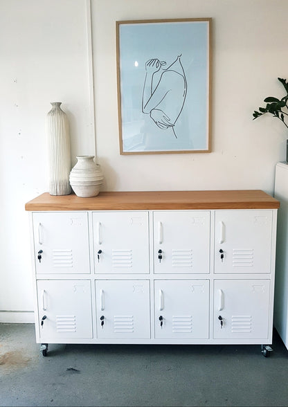 white 8-door sideboard locker with a recycled Rimu top on caster wheels. Mobile lockable storage