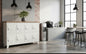 A white 8-door sideboard locker with a recycled Rimu top, featuring individual lockers and a handle on each door, set against a rustic backdrop.