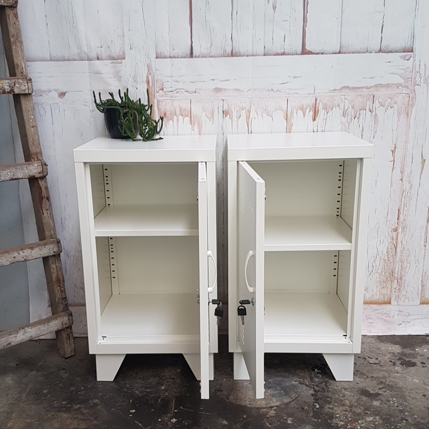 white lockers with open doors showing adjustable shelves 